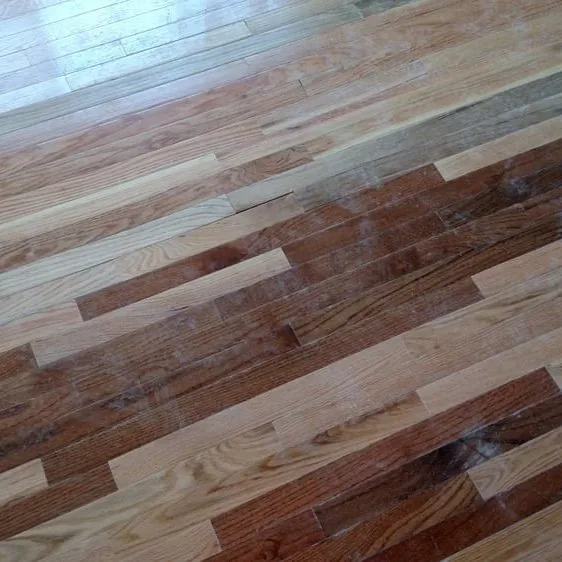 Mixed-tone hardwood planks laid out across a floor